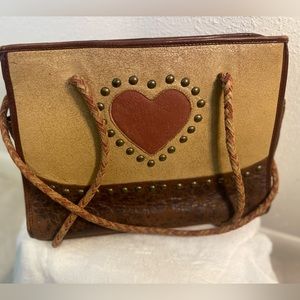 Leather purse with studs and leather straps